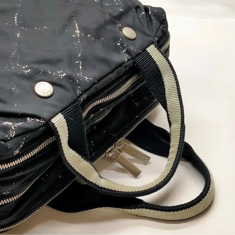CHANEL Cream and Black Travel Bag with Elegant Design